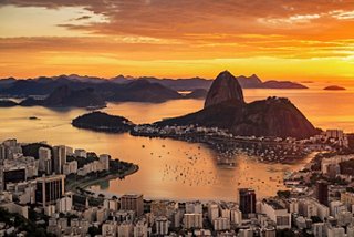 A stunning aerial view of Botafogo Bay and Sugarloaf Mountain at sunset in Rio de Janeiro, Brazil | MSC Cruises