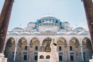 A stunning mosque with arches and a dome framed by blue sky in Istanbul, inviting visitors to explore its beauty | MSC Cruises