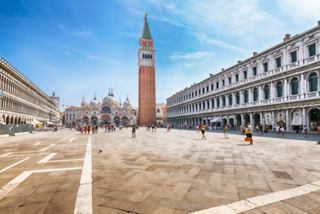 The vibrant San Marco Square in Venice, featuring its iconic tower and stunning architecture under a clear blue sky | MSC Cruises