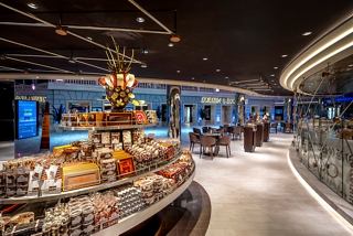 A vibrant bar area with a selection of chocolates and sweets, inviting guests to indulge in delightful treats | MSC Cruises