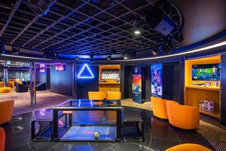 A vibrant and inviting space designed for family entertainment, featuring colourful seating and engaging activities | MSC Cruises