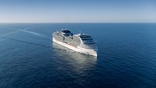 Aerial view of MSC World Europa sailing smoothly on the sea under a clear sky | MSC Cruises