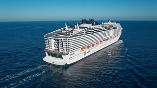 Aerial view of MSC World Europa sailing through calm waters under a clear sky | MSC Cruises