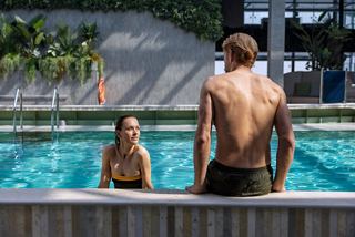 A couple enjoys a relaxing moment by the pool at the Botanic Garden Pool on MSC World Europa | MSC Cruises