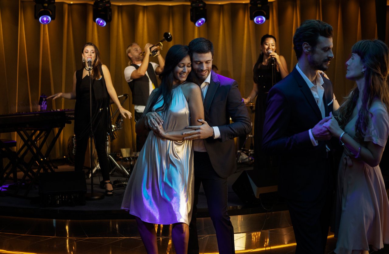Couples enjoy a romantic evening dancing to live music in the Dolce Vita Bar aboard MSC World Europa | MSC Cruises