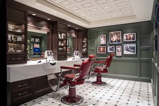 A stylish barber area in MSC Aurea Spa featuring elegant chairs and mirrors for a refreshing grooming experience | MSC Cruises