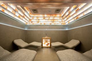 A tranquil thermal area featuring comfortable loungers and soft lighting for relaxation at MSC Aurea Spa | MSC Cruises