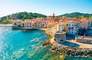 A vibrant coastal view of Toulon, showcasing the beautiful Mediterranean waters and charming buildings | MSC Cruises