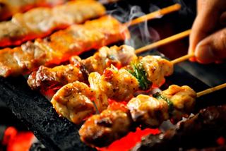 Grilled yakitori chicken skewers being prepared, showcasing the vibrant culinary experience onboard | MSC Cruises