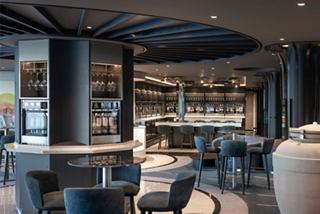 A stylish bar area with modern furnishings and a welcoming atmosphere invites relaxation and enjoyment | MSC Cruises