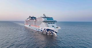 An aerial view of MSC Euribia sailing gracefully on the calm sea beneath a clear sky | MSC Cruises