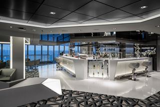 An elegant Champagne Bar featuring modern design and inviting seating for guests to enjoy | MSC Cruises