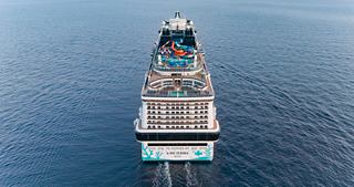 Aerial view of MSC Euribia sailing gracefully on the sea with a vibrant pool and aquapark on board | MSC Cruises