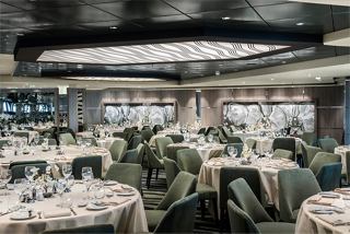 An elegant dining area on MSC Euribia, featuring beautifully set tables and a warm ambiance for guests | MSC Cruises