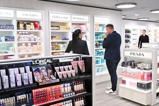Guests interact with crew members in the vibrant Shopping Gallery onboard MSC Euribia | MSC Cruises