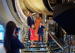 A family joyfully explores the Swarovski staircase aboard MSC Seashore, creating lasting memories together | MSC Cruises