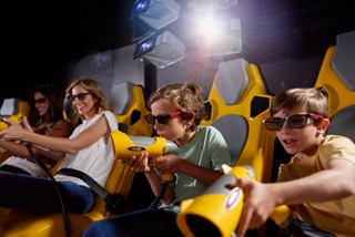 Young and adults wearing 3D glasses enjoying themselves on board a cruise | MSC Cruises