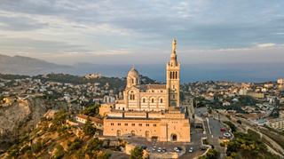 Aerial view of Notre-Dame de la Garde overlooking the city of Marseille in the Mediterranean | MSC Cruises