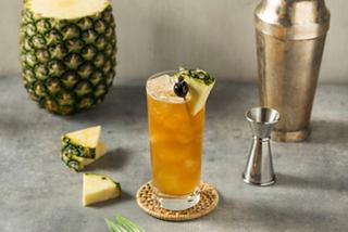 A refreshing Bahama Mama cocktail garnished with pineapple and served in a glass, perfect for Caribbean excursions | MSC Cruises