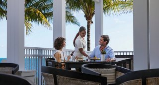 Couple enjoying sea view from cruise balcony | MSC Cruises
