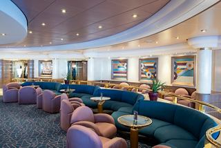 A stylish lounge area featuring comfortable seating and a welcoming atmosphere for relaxation | MSC Cruises