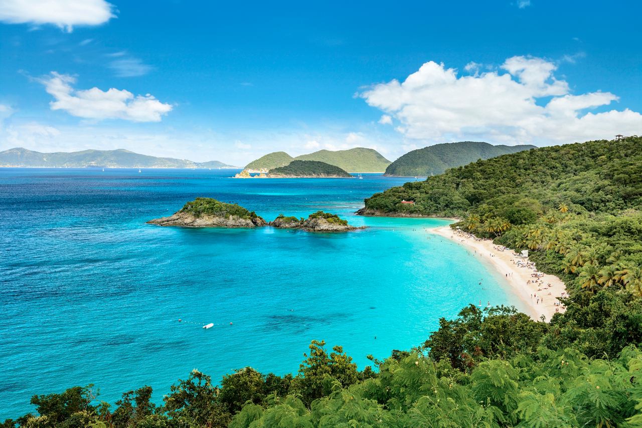 A stunning view of Trunk Bay on Saint John Island, showcasing turquoise waters and lush greenery | MSC Cruises