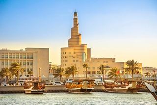 View of Doha's waterfront featuring stunning buildings and traditional dhows | MSC Cruises