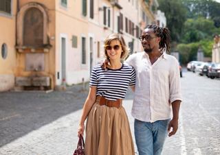 A couple enjoys a scenic walk together in Civitavecchia, Italy, embracing the charm of the Mediterranean | MSC Cruises