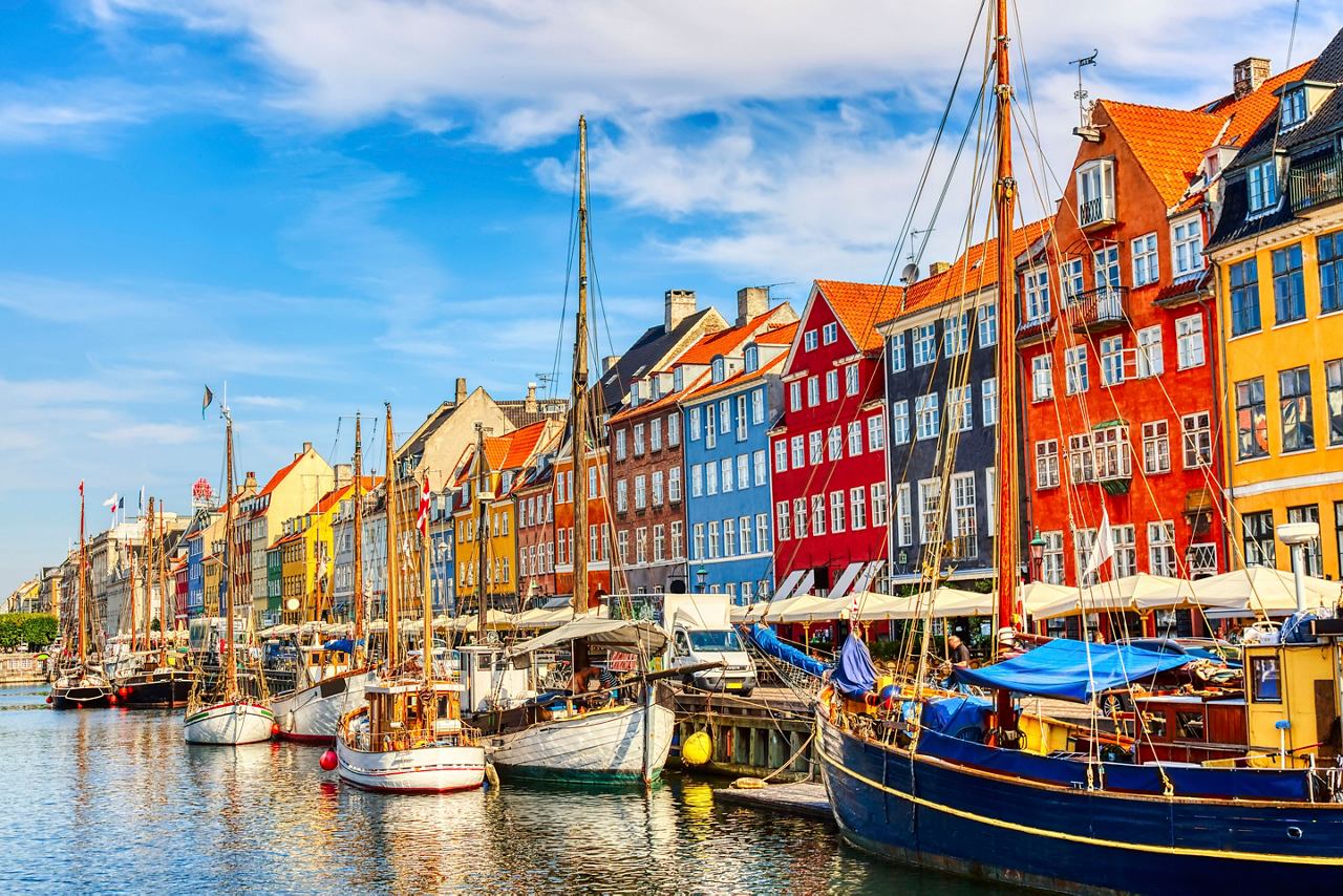 Colorful buildings and boats along the canal in Copenhagen, Denmark. | MSC Cruises
