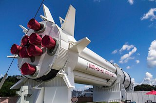 A powerful rocket stands proudly against a vibrant blue sky at the Kennedy Space Center in Florida | MSC Cruises