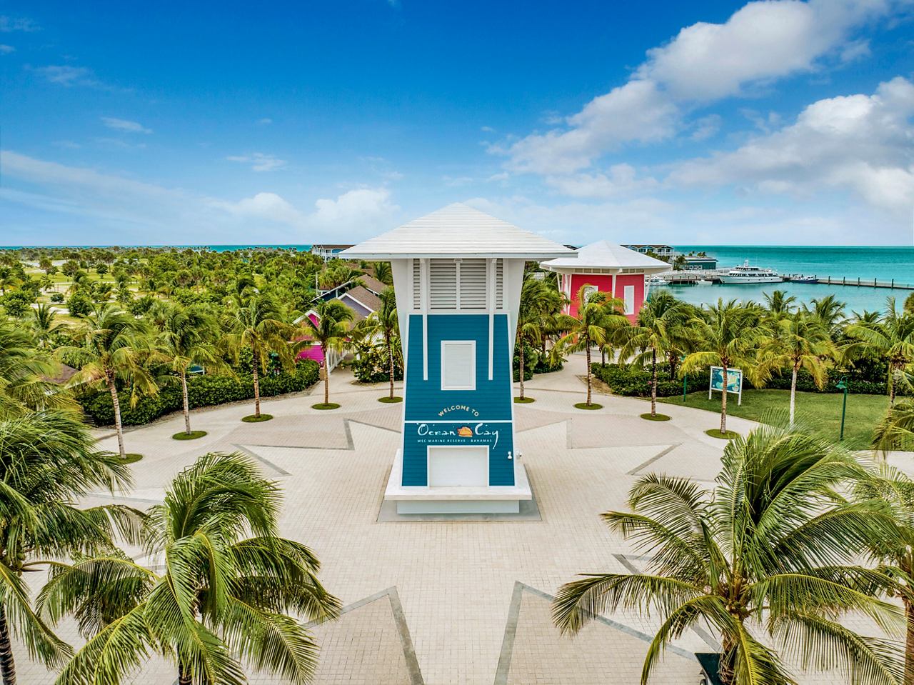The entrance to Ocean Cay MSC Marine Reserve, surrounded by lush greenery and a vibrant blue sky | MSC Cruises