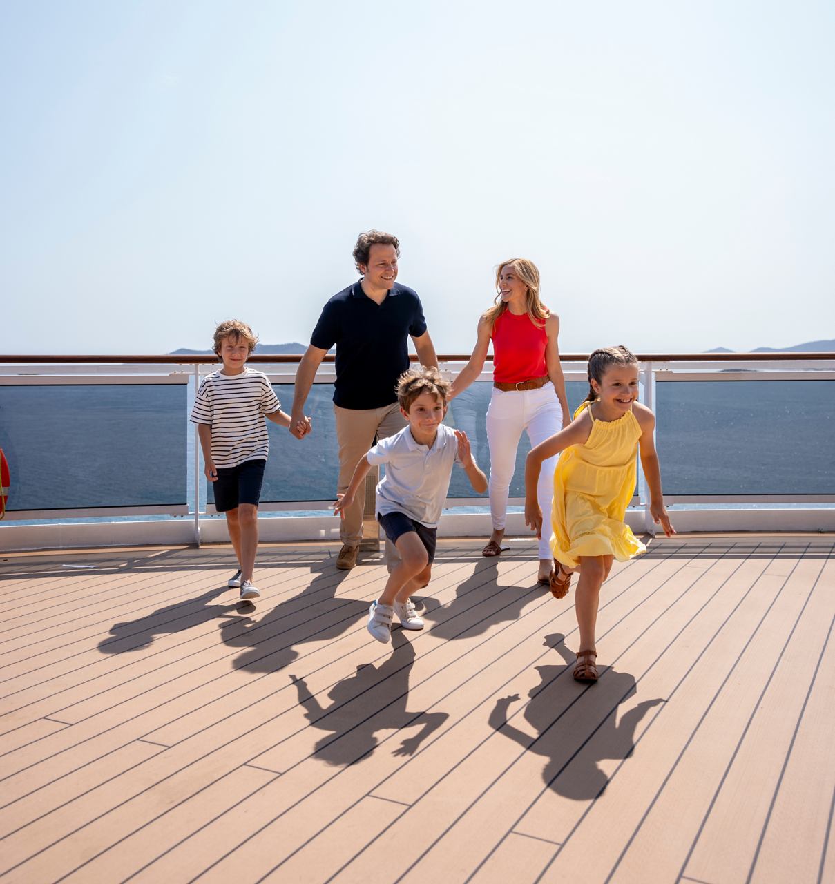 A joyful family on the deck of a cruise ship | MSC Cruises