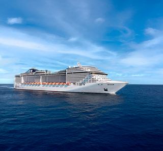 Aerial view of MSC Fantasia ship at sea under clear sky starboard side | MSC Cruises