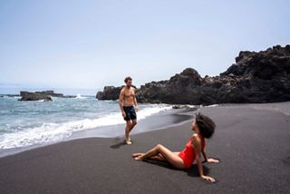 A couple relaxes on a beach in the Canry Islands | MSC Cruises