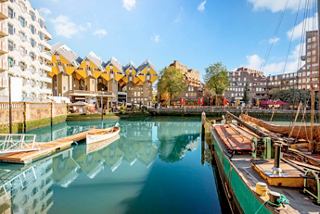 A scenic view of the Oude Haven in Rotterdam featuring unique architecture and calm waters | MSC Cruises