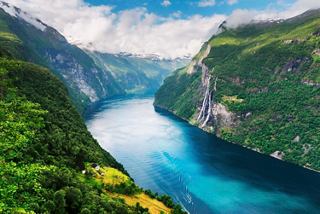 Breathtaking view of Sunnylvsfjorden surrounded by lush green mountains | MSC Cruises