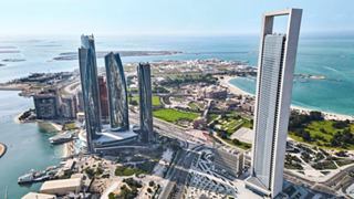A breathtaking aerial view of Abu Dhabi showcasing its iconic skyscrapers and vibrant coastal landscape | MSC Cruises
