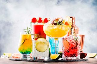 A vibrant selection of cocktails on display, inviting you to enjoy a refreshing experience at Aurea Bar | MSC Cruises