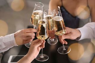 A group of friends toasting with champagne glasses in a festive atmosphere | MSC Cruises
