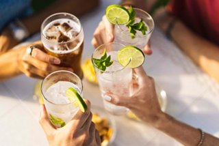 Cheers to friendship with refreshing drinks in hand, celebrating together at the Aurea Bar on MSC Seashore | MSC Cruises