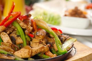 A vibrant dish featuring beef and vegetables, served with tortillas and chili, ready to delight diners | MSC Cruises