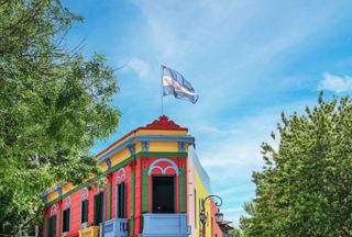 Colorful building with a flag in La Boca, Buenos Aires | MSC Cruises