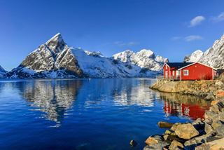 Colorful house in a snowy Norwegian fjord | MSC Cruises