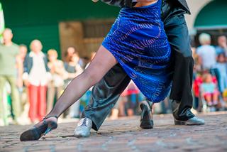 A couple dances tango on the streets of Buenos Aires, captivating the audience around them | MSC Cruises