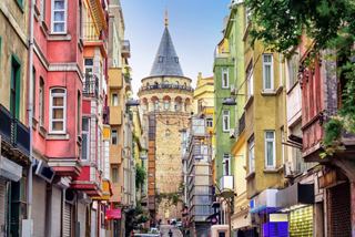 A vibrant street in Istanbul with colourful buildings and the iconic Galata Tower in the background | MSC Cruises