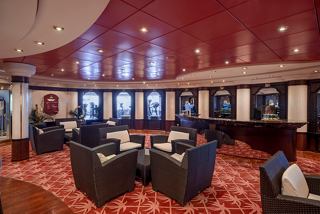 A luxurious sitting area with armchairs and tables, inviting relaxation in the MSC Aurea Spa on MSC Orchestra | MSC Cruises