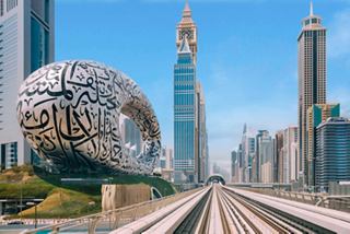 Contemporary architecture in Dubai featuring the Museum of the Future and skyscrapers under a blue sky | MSC Cruises