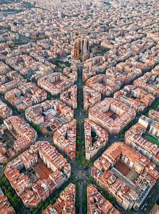 Aerial view of Barcelona showcasing the city's layout with Sagrada Familia in the distance | MSC Cruises