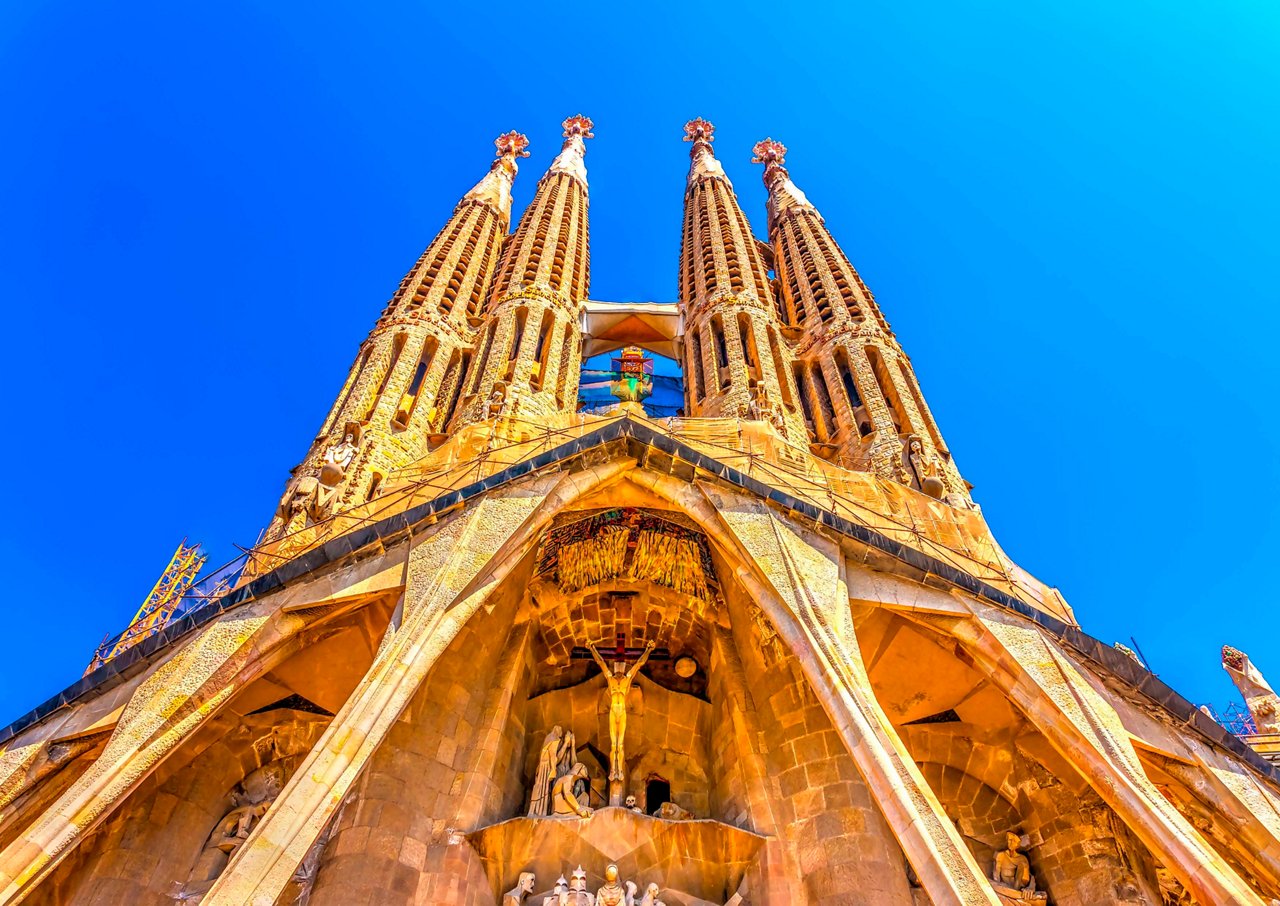 The stunning architectural details of the Sagrada Familia rise majestically against a clear blue sky | MSC Cruises