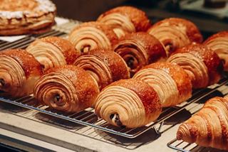Freshly baked pain au chocolats arranged neatly, inviting a delightful taste experience in France | MSC Cruises